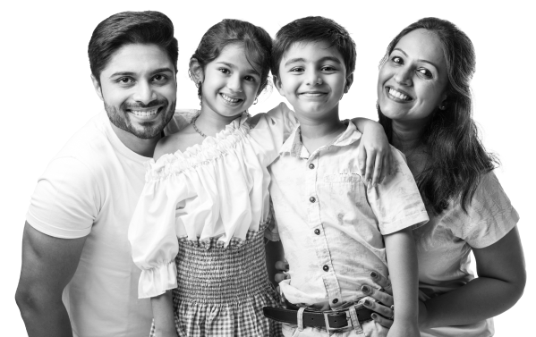 beautiful-indian-young-family-four-hugging-looking-camera-smiling-while-standing-against-white-background copy 1